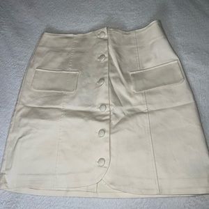 Cream skirt.